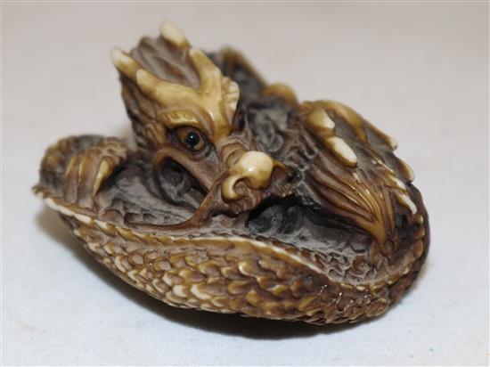 A Japanese stag antler netsuke of two entwined dragons, 20th century, 4.5cm